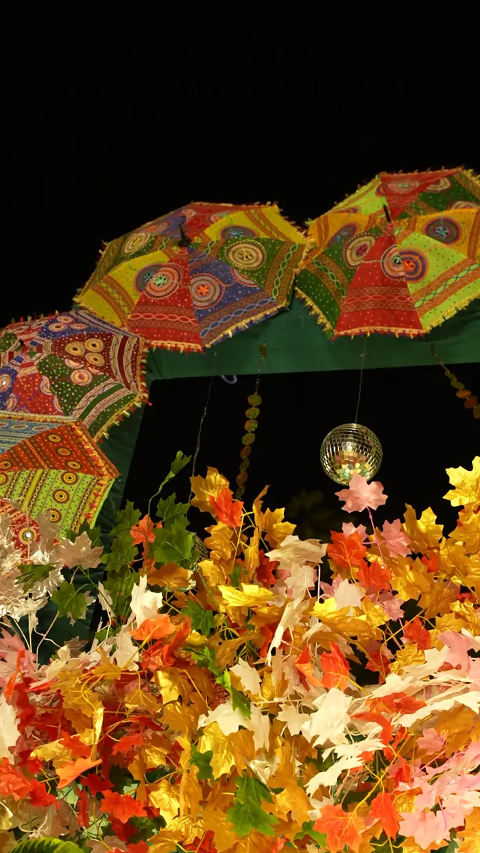 Colourful umbrella and floral décor by Perfecplan